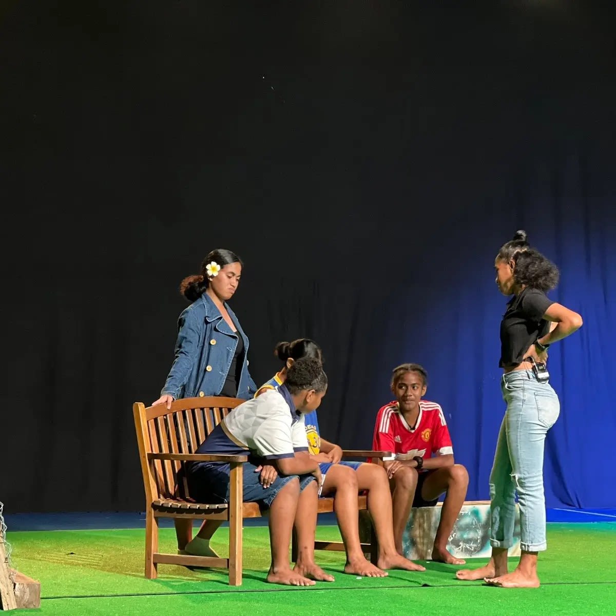 Members of FWRM's GIRLS program on stage as part of their theatre production for 16 Days of Activism.
