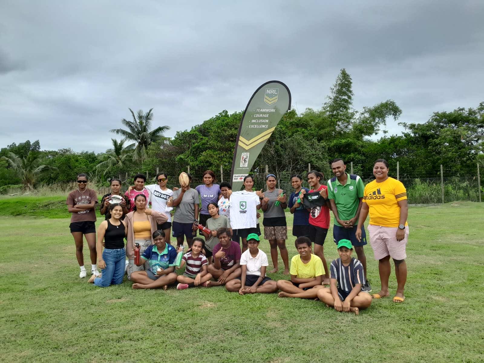 Members of FWRM's GIRLS program posing together at NRL in Fiji's sports clinic.