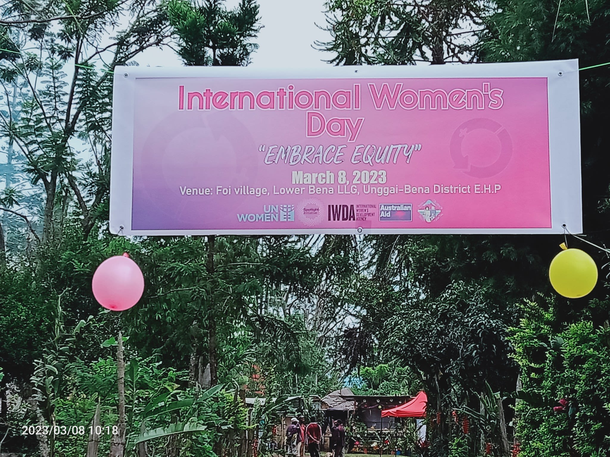 A banner at one of East Highlands Family Voice's International Women's Day event that reads, 'International Women's Day - "Embrace Equity", March 8 2023. Venue: Foi Village, Lower Bena LLG, Unggai-Bena District E.H.P.'